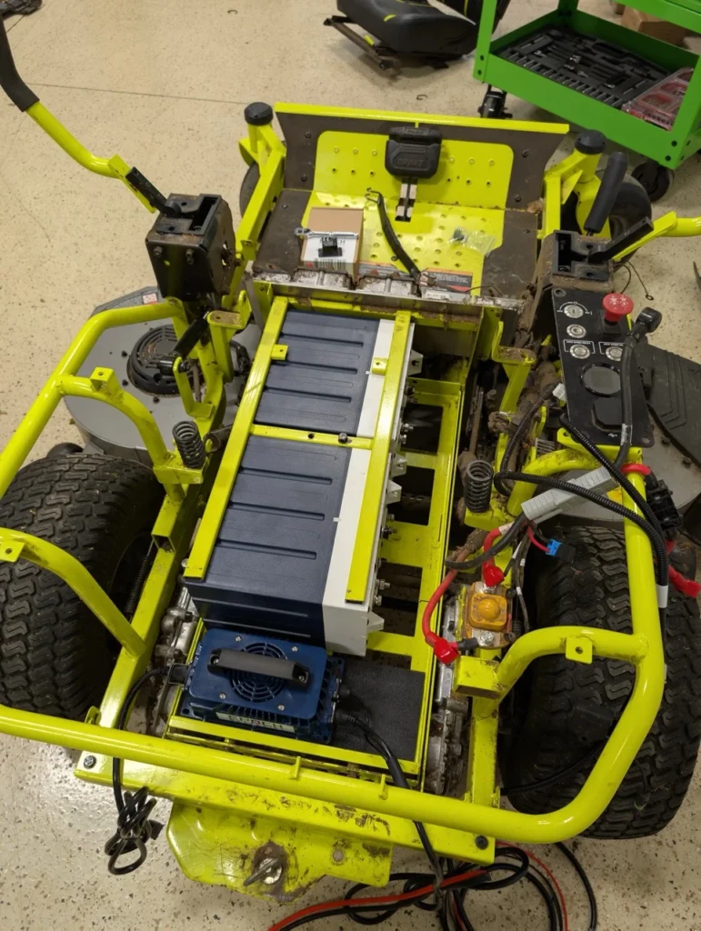 These pictures depict the BEST Battery team performing a Ryobi Zero-Turn Mower Battery Upgrade on a ZT540e model zero-turn mower.