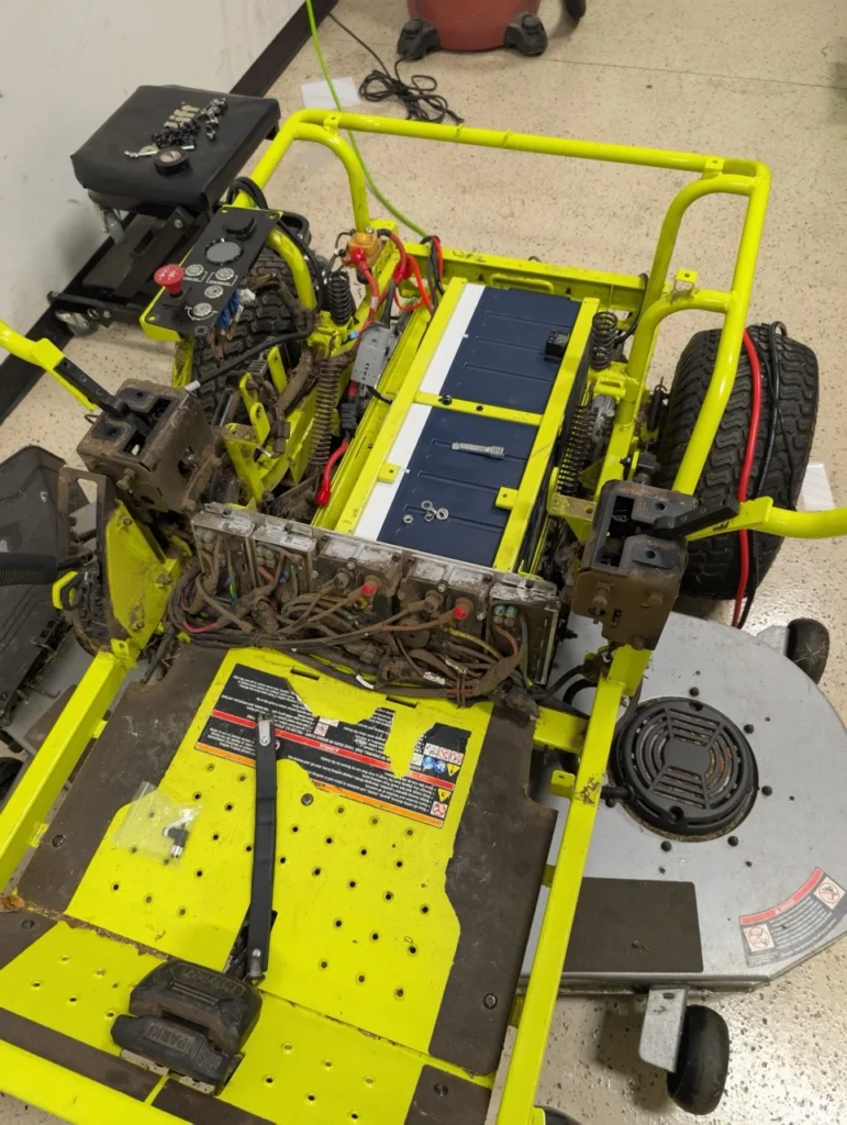 These pictures depict the BEST Battery team performing a Ryobi Zero-Turn Mower Battery Upgrade on a ZT540e model zero-turn mower.
