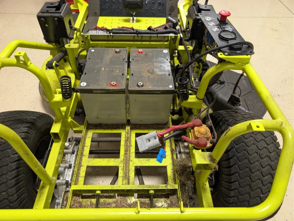 Partially removed lead acid batteries, our new Qomo Energy battery will easily fit in this space as part of our Ryobi ZT480 Battery Upgrade.