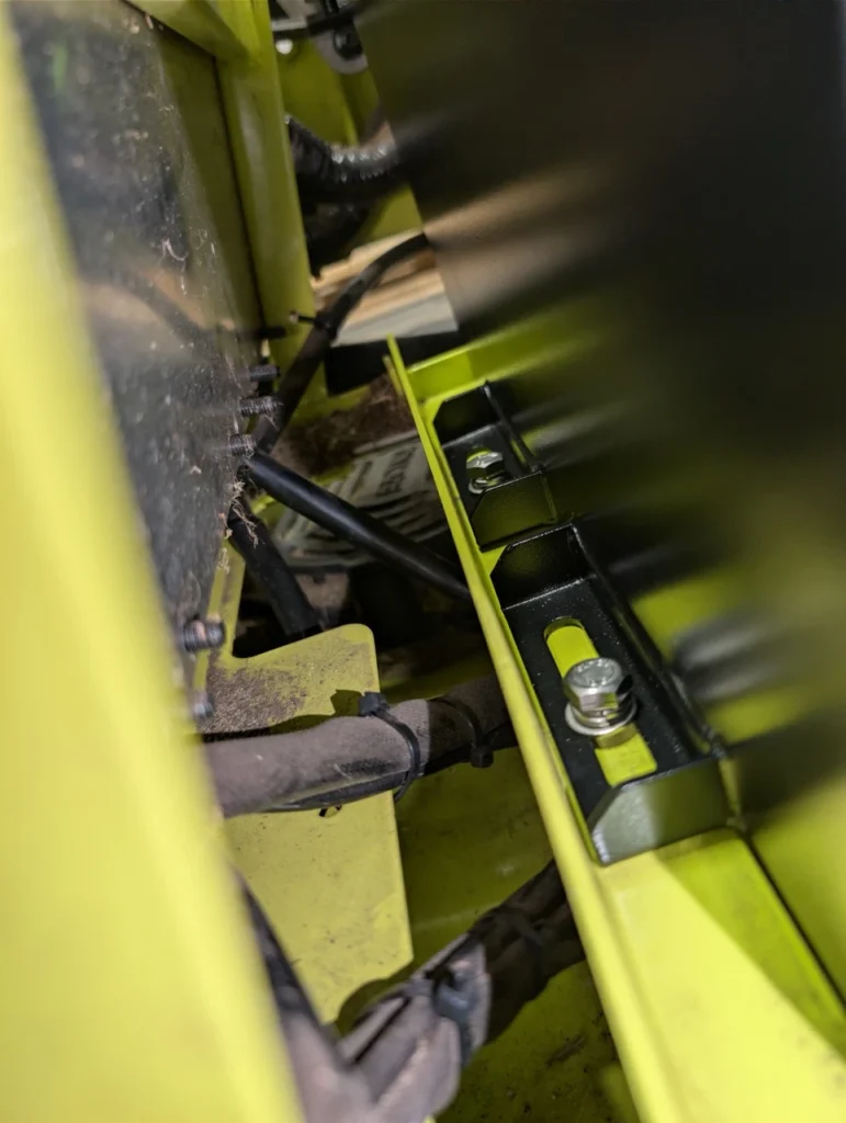 Tight view of the brackets where the new Qomo Energy lithium battery has been mounted.