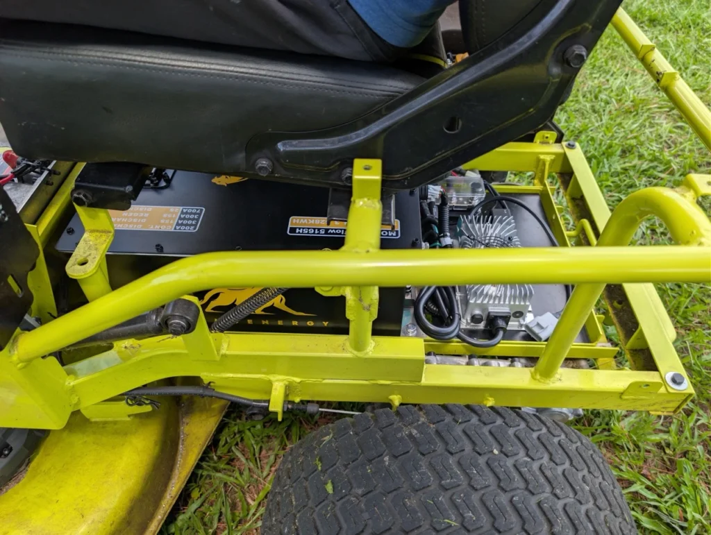 The Qomolander battery kit we used for the installation fits comfortably in the existing battery compartment.